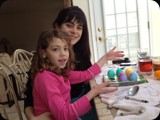 Gia and Jade coloring eggs